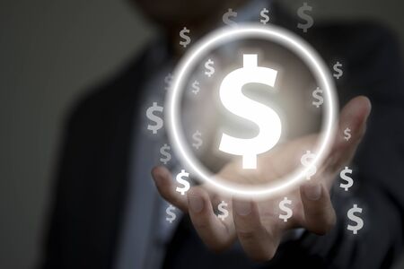 Businessman with protective gesture hand for dollar sign. US dollar is main and popular currency of...