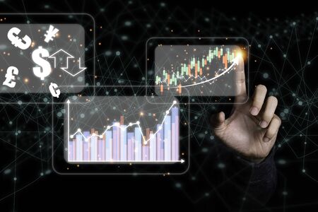 Hand touching to virtual infographic investment graph and exchange currency.Stock investment business growth concept.の写真素材