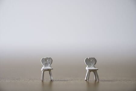 White miniature chair keep distance at public and prevent COVID-19 corona virus outbreak spread pandemic infection. Social distancing concept.の写真素材