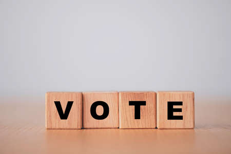 Vote and election concept, Vote wording print screen on wooden cubes block.の写真素材