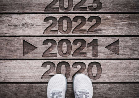 2021 year carved on old wood with shoes.Merry Christmas and happy new year concept.