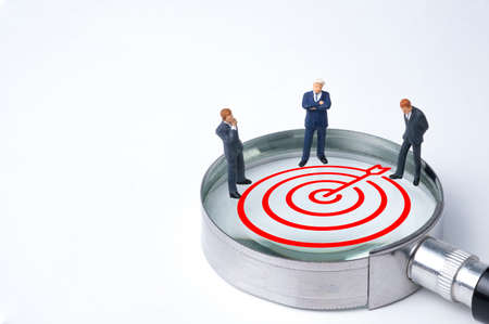 Concentrate setup objectives target and business goal , Three manager miniature figures standing and...