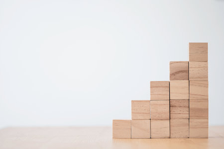 stacking of blank wooden cubes on table with copy space for input wording and infographic icon.