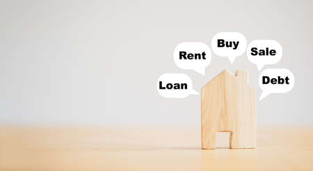 Wooden house model with message icon include loan rent buy sale and debt. It is symbol thinking way...
