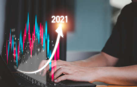 Business investor using computer laptop to analysis beautiful virtual stock market chart , business...