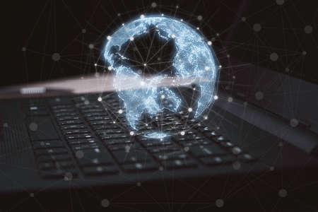 Virtual world and connection lines on computer laptop for global networks concept.の写真素材