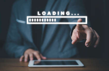 Businessman using tablet and touching to virtual loading tar for download and upload application and...