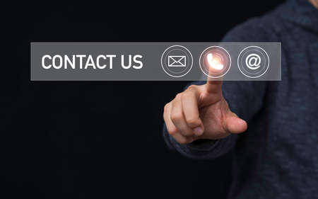 Businessman touching to virtual mobile phone among e-mail and address for business contact and...