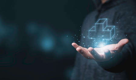 Businessman holding virtual plus sign which it mean positive sign such as more benefit thinking and mindset concept.の写真素材