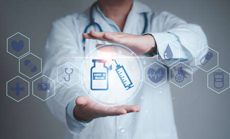 Doctor showing Corona virus 19 vaccine and syringe icon with health care icon , Distribution...