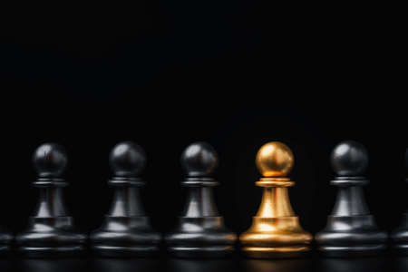 Golden pawn chess among silver for different thinking idea and disruption concept.の写真素材