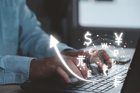 Businessman use laptop with virtual world connection and currency include dollar euro yen pound sterling and yuan , Money transfer and forex exchange concept.の写真素材