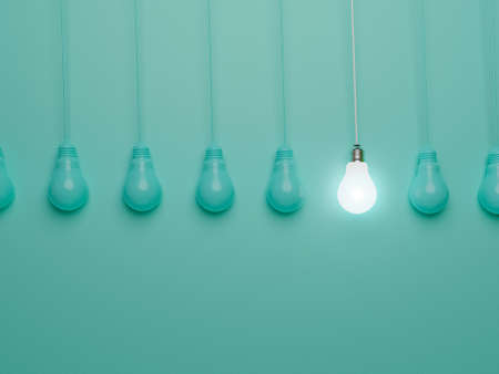 One hanging light bulb glowing from others bulbs on blue background for outstanding ,different creative thinking idea and innovation concept by 3d render.の写真素材