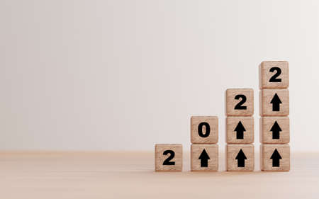 2022 year and rise up arrow print screen on wooden cube block and copy space for preparation
start new business plan in 2022 by 3d render.の写真素材