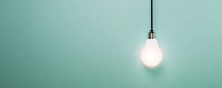 One hanging light bulb glowing on blue background for creative thinking idea and innovation concept by 3d render.の写真素材