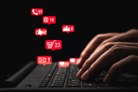 Man hand using laptop computer with Social media and business icons for technology and marketing concept.の写真素材