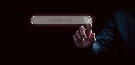 Man hand touching to virtual screening searching icon for Web search engine concept.の写真素材