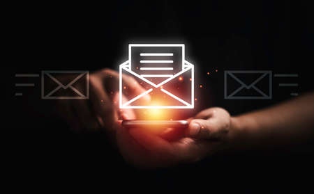 Businessman using smartphone to open e-mail for business contact and communication concept.の写真素材