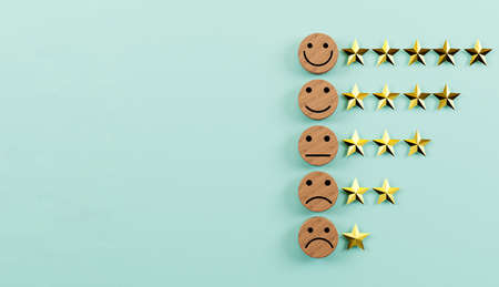 emotion face print screen on circle wooden block with golden stars for the best customer client evaluation for use product and service concept by 3d rendering.の写真素材