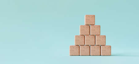 stacking blank wooden cubes on blue background and copy space for input wording and infographic icon...