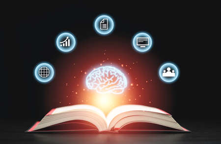 Glowing virtual brain floats above an open book with leaning icons on dark background which is a symbol of study  a knowledge will help solve problem and solution concept.の写真素材