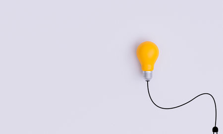 Isolate of yellow lightbulb with wire harness on white background for creative thinking idea to problem solving and solution concept by 3d rendering.の写真素材