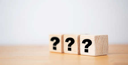 Question mark print screen on wooden cube block with copy space for question and answer concept.