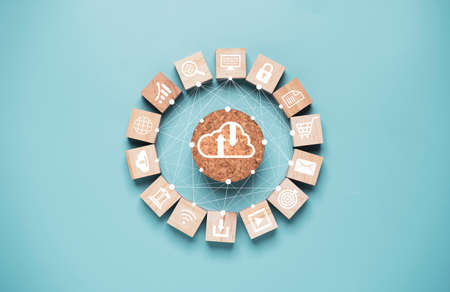 Cloud computing and technology icon print screen on wooden cube block and connection linkage drawing for tech sharing and transformation concept.の写真素材
