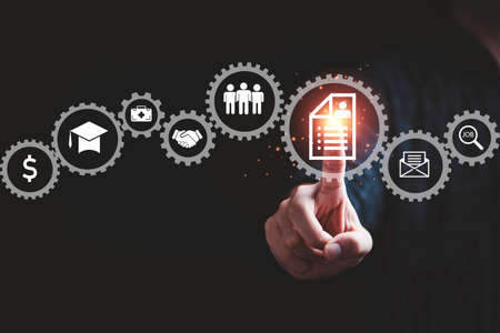 Hand touching to resume sheet  and others icon which related with job search apply for job...