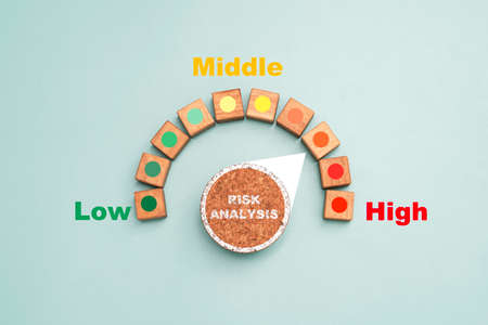 Risk level indicator rating print screen wooden cube block since low middle and high on blue...