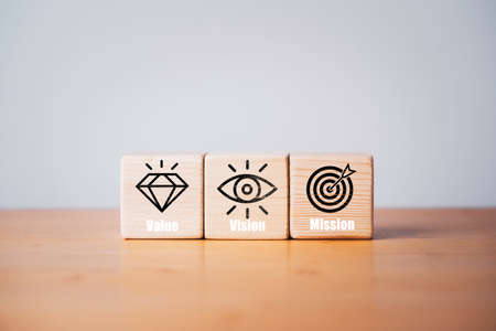 Mission Vision and Mission icons print screen on wooden block for company business statement concept.の写真素材