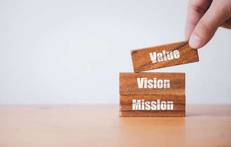Mission Vision and Mission print screen on wooden block for company business statement concept.の写真素材