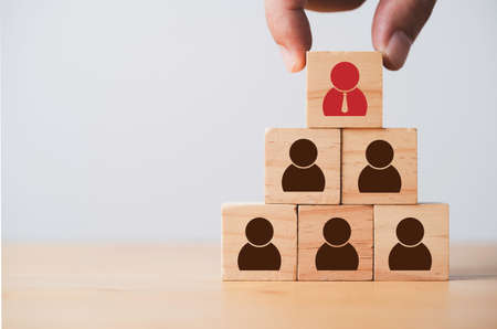 Hand hold management icon stack on to staff icon for Human development recruitment business concept.の写真素材