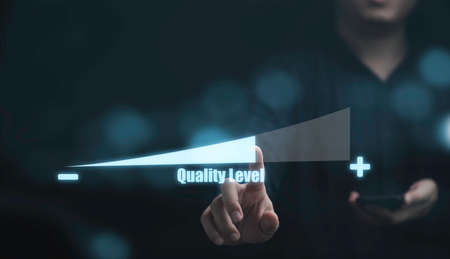 Businessman touching to virtual scale level to increase quality level from lotto high for enhance...