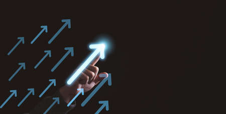 Businessman touching rise up white arrow for business and profit growth concept.の写真素材