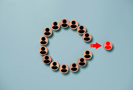 Red human icon move out from group black human icons for performance outstanding and different thinking idea concept.の写真素材