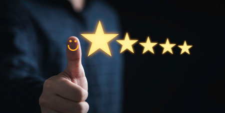 Thumb up with glowing yellow five stars for excellent evaluate after customer use product service , ISO and quality standard certificate concept.の写真素材