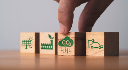 CO2 reducing ,Green factory and electric vehicle icon for decrease CO2 , carbon footprint and carbon credit to limit global warming from climate change, Bio Circular Green Economy concept.の写真素材