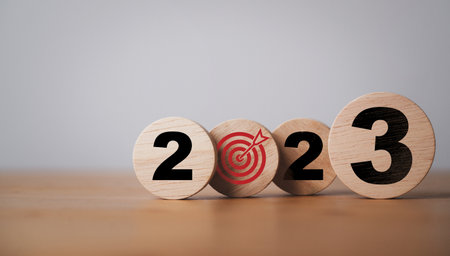 2023 year and target board print screen on wooden block cube for setup new year business objective and goal concept.の写真素材