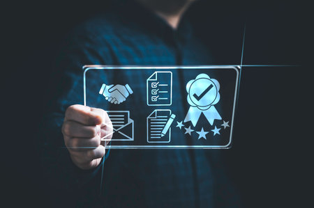 Businessman using virtual tablet with quality assurance and document icon for ISO or International Standard Organisation which related quality control and continuous improvement concept.の写真素材