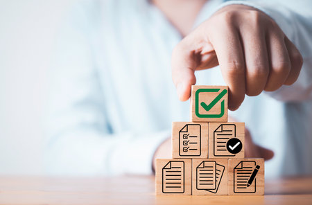 Businessman stacking of document and correct sign mark for document approve , project acceptance and quality assurance concept.の写真素材