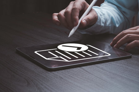 Businessman using tablet and electronic pen with virtual document and mark correct sign for online approve  paperless and quality assurance concept.の写真素材