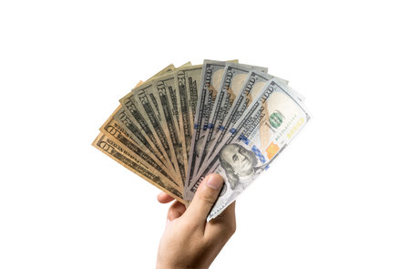 Isolate of hand holding USD dollar banknote with clipping path , Dollar is the main money which the...