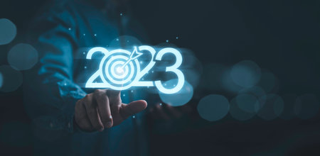 Businessman touching to glowing 2023 with dartboard for setup new business objective target and goal  since new year concept , Happy new year and merry Christmas concept.の写真素材