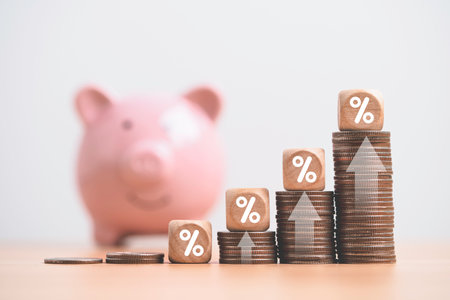 Increasing coin stacking with up arrow and percentage sign for increase financial interest rate and business investment growth from dividend concept.の写真素材