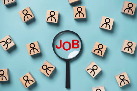 Red job wording inside of  magnifier glass  surrounding with persons icon for job recruitment and human development concept.の写真素材