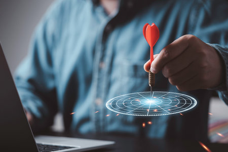 Businessman throwing red arrow dart to virtual target dart board, Setup objectives and target for business investment concept.の写真素材