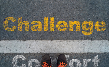 Man standing on road with screening comfort wording and challenge wording for Overcoming challenge and obstacle concept.の写真素材