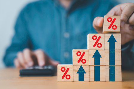Businessman putting red percentage sign with increasing up arrow for financial interest rate and business investment growth from dividend concept.の写真素材