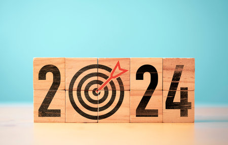 2024 year with dartboard and arrow on wooden block cube for setup new business objective target and goal  since new year concept , Happy new year and merry Christmas concept.の写真素材